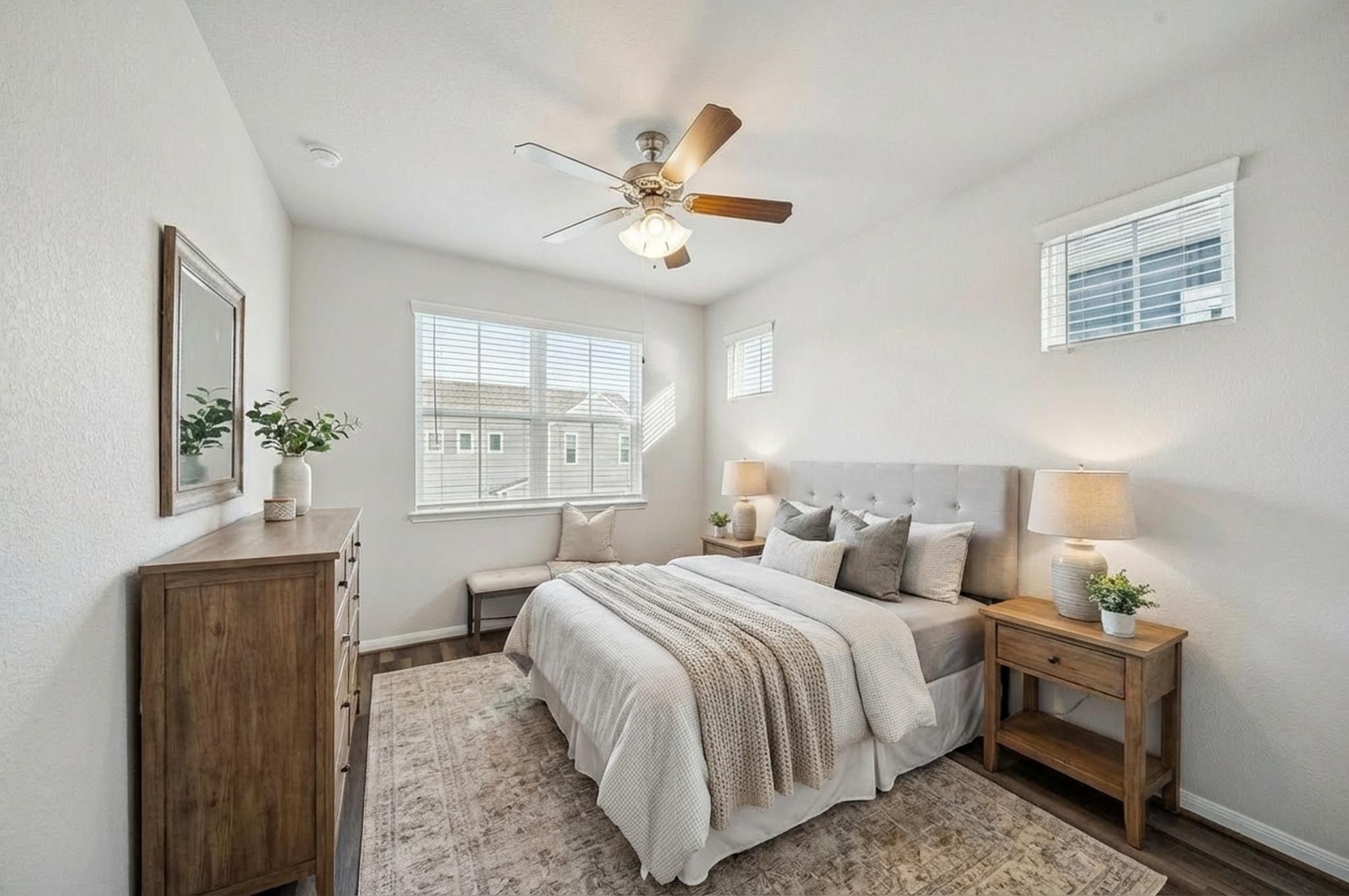 9817 Prairie Garden Lane Houston, TX 77080 - Photo 20 of 36 a bedroom with a bed and a chandelier