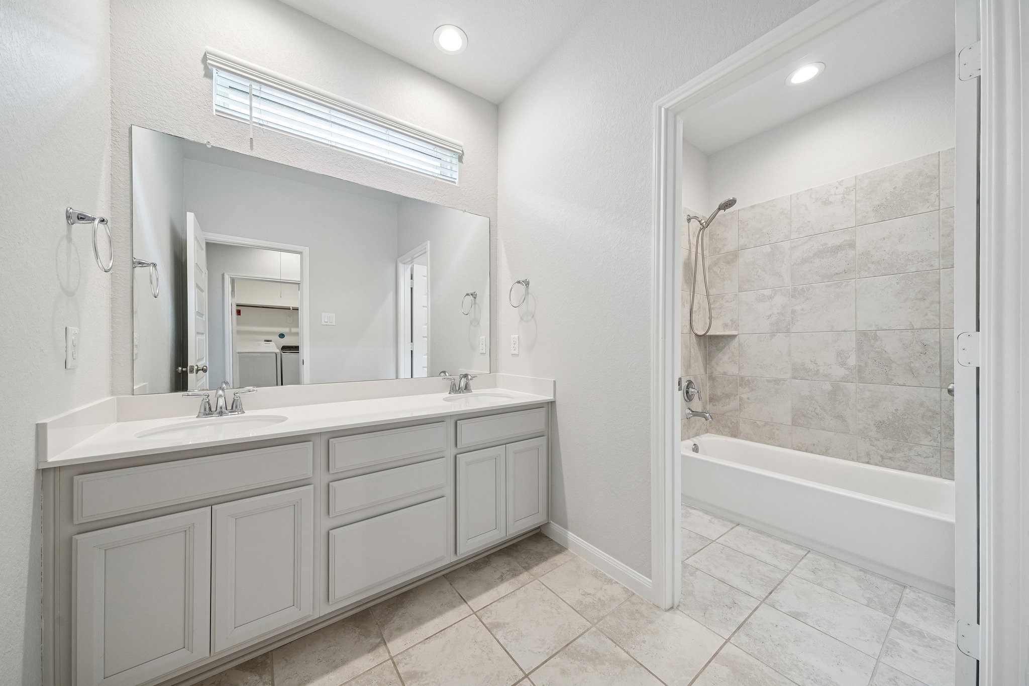 9817 Prairie Garden Lane Houston, TX 77080 - Photo 21 of 36 a bathroom with a tub sink and mirror