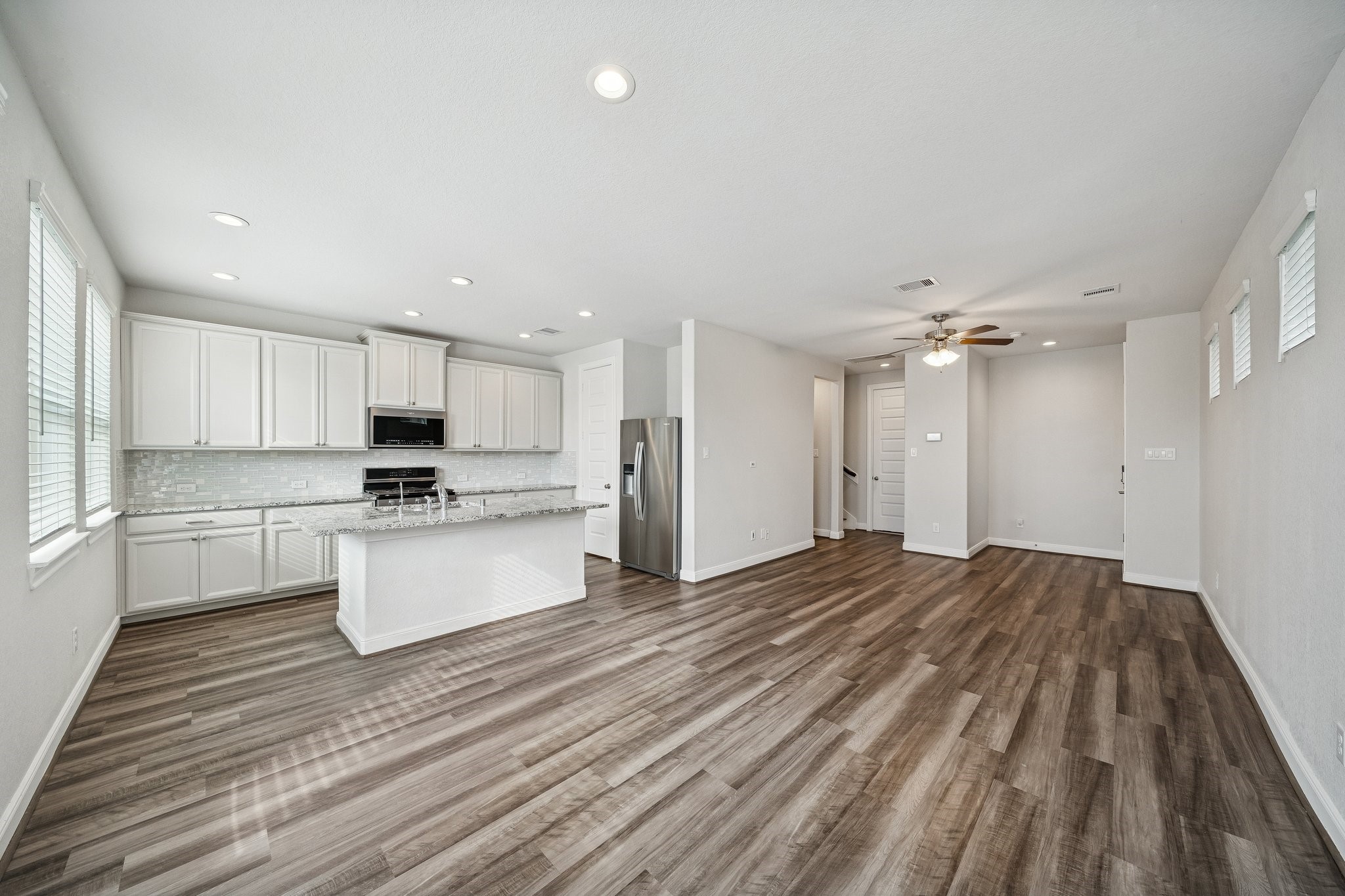 9817 Prairie Garden Lane Houston, TX 77080 - Photo 5 of 36 a view of kitchen with wooden floor and electronic appliances