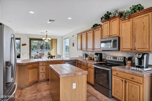 a bathroom with a sink toilet tub and shower