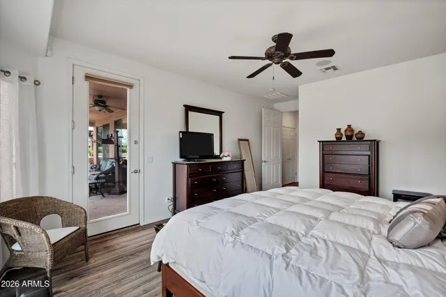 a living room with furniture a rug and a chandelier