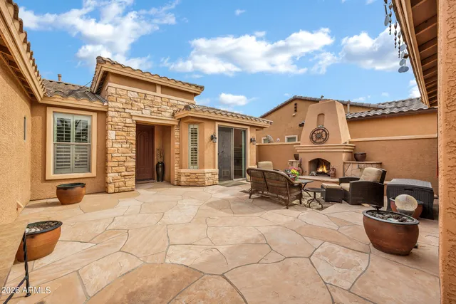 a living room with furniture ceiling fan and a window