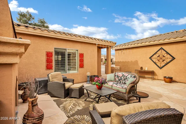 a living room with furniture flat screen tv and a fireplace