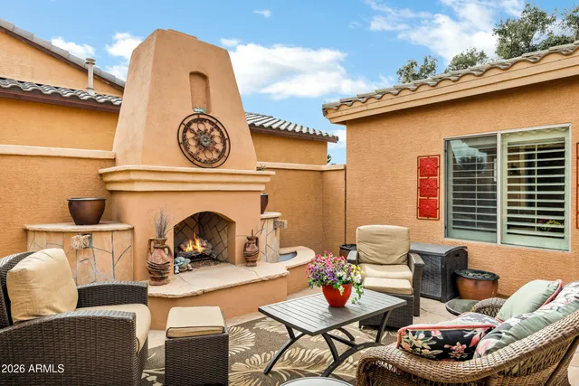 a kitchen with stainless steel appliances granite countertop a stove a sink dishwasher and a microwave oven on the blue kitchen countertops