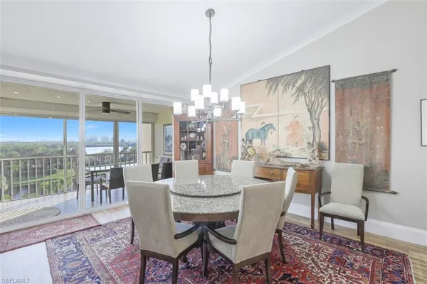 a kitchen with granite countertop a table and chairs