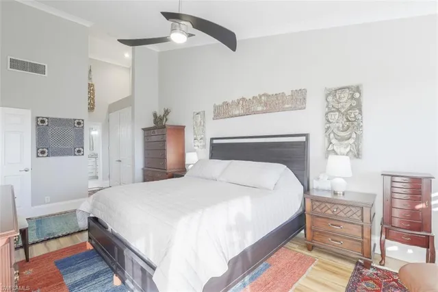 a bedroom with a bed and with furniture