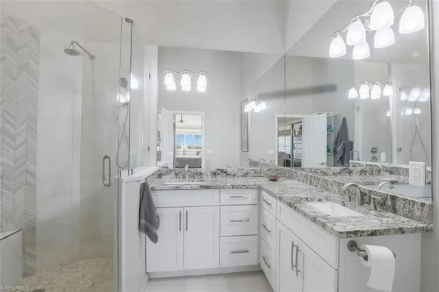 a bedroom with two beds and a window