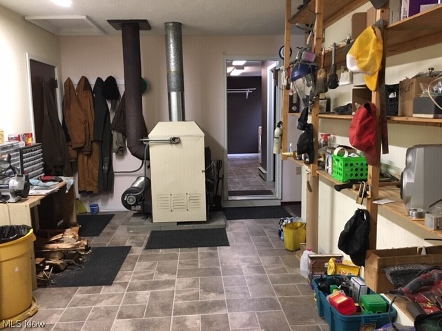 15429 Tavern Road Burton, OH 44021 - Photo 22 of 34 Step down into the indoor workshop, which will be a favorite for the resident DIY person!