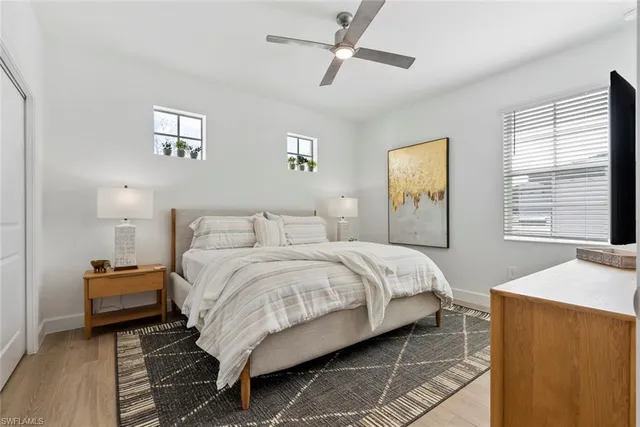 a bedroom with bed and a window