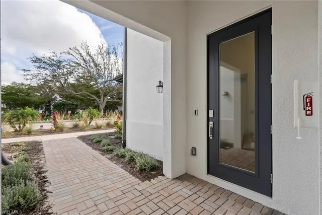 a bathroom with a glass door and shower