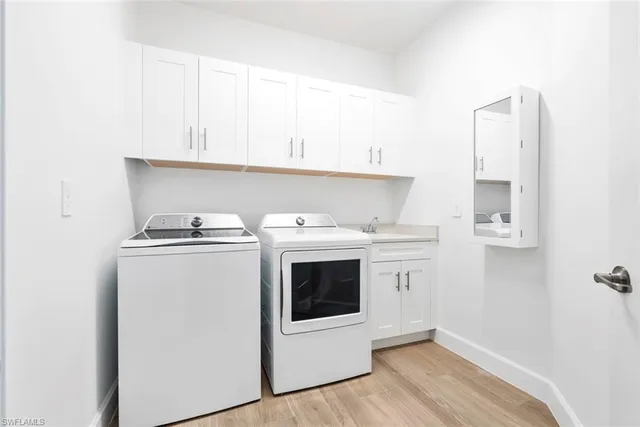 a view of a livingroom with furniture and a flat screen tv