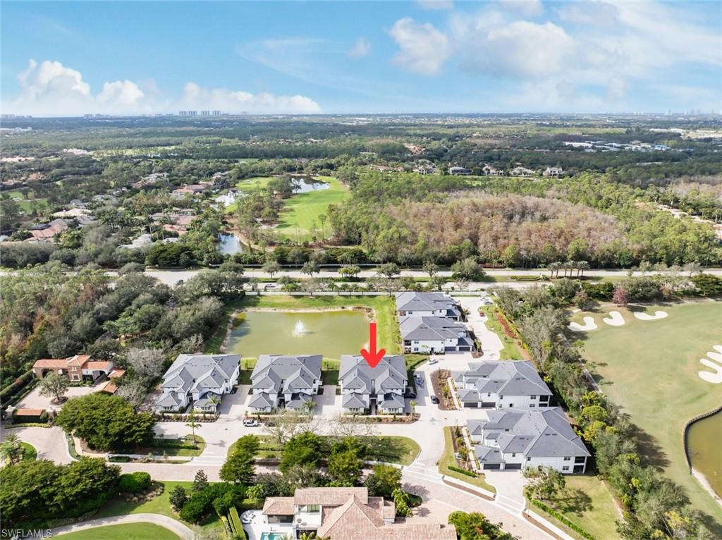 16889 Fairgrove Way, Unit 5201 Naples, FL 34110 - Photo 27 of 28 a view of a city with lake