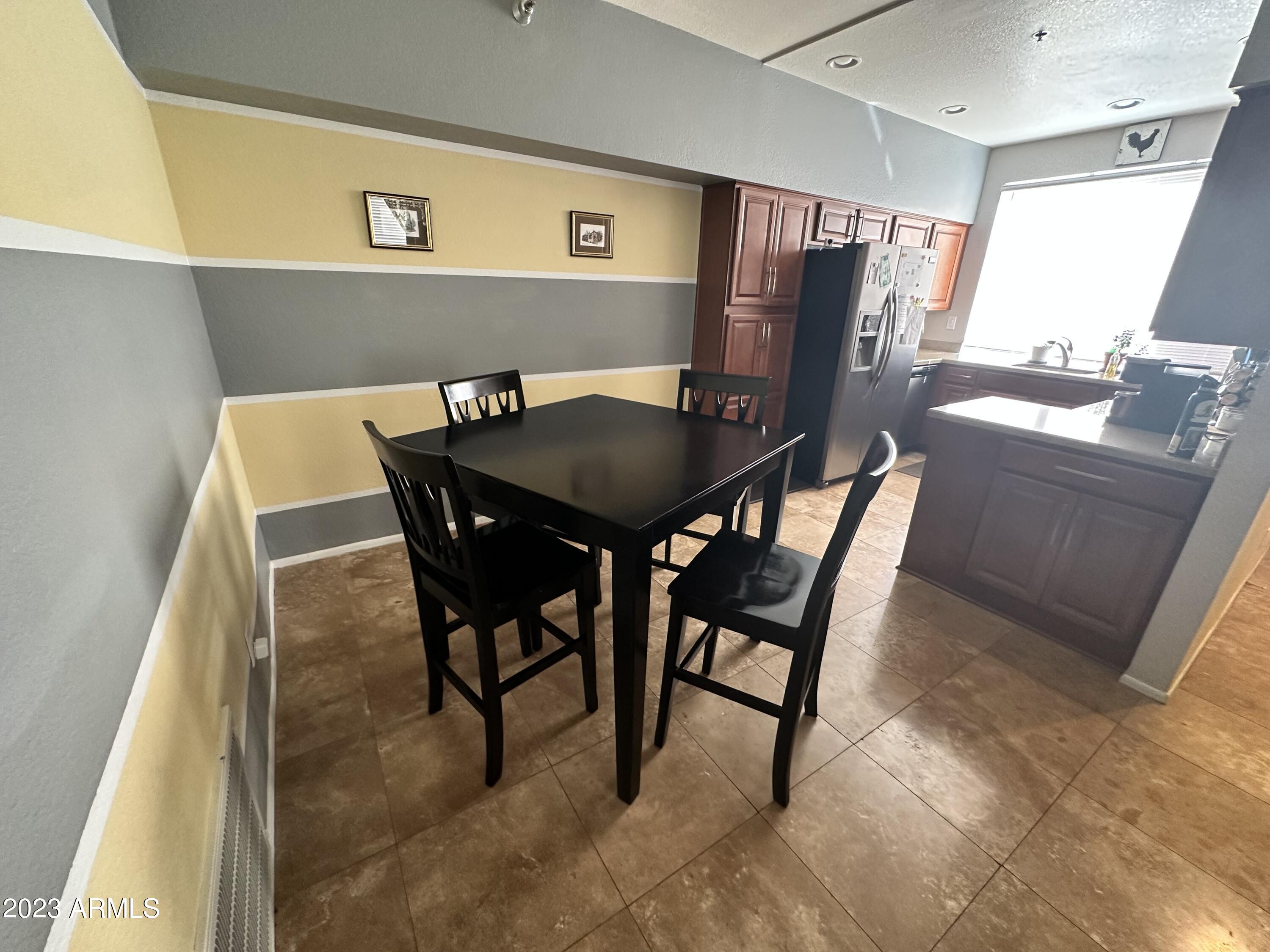 154 West 5th Street, Unit 149 Tempe, AZ 85281 - Photo 3 of 9 a view of a dining room with furniture