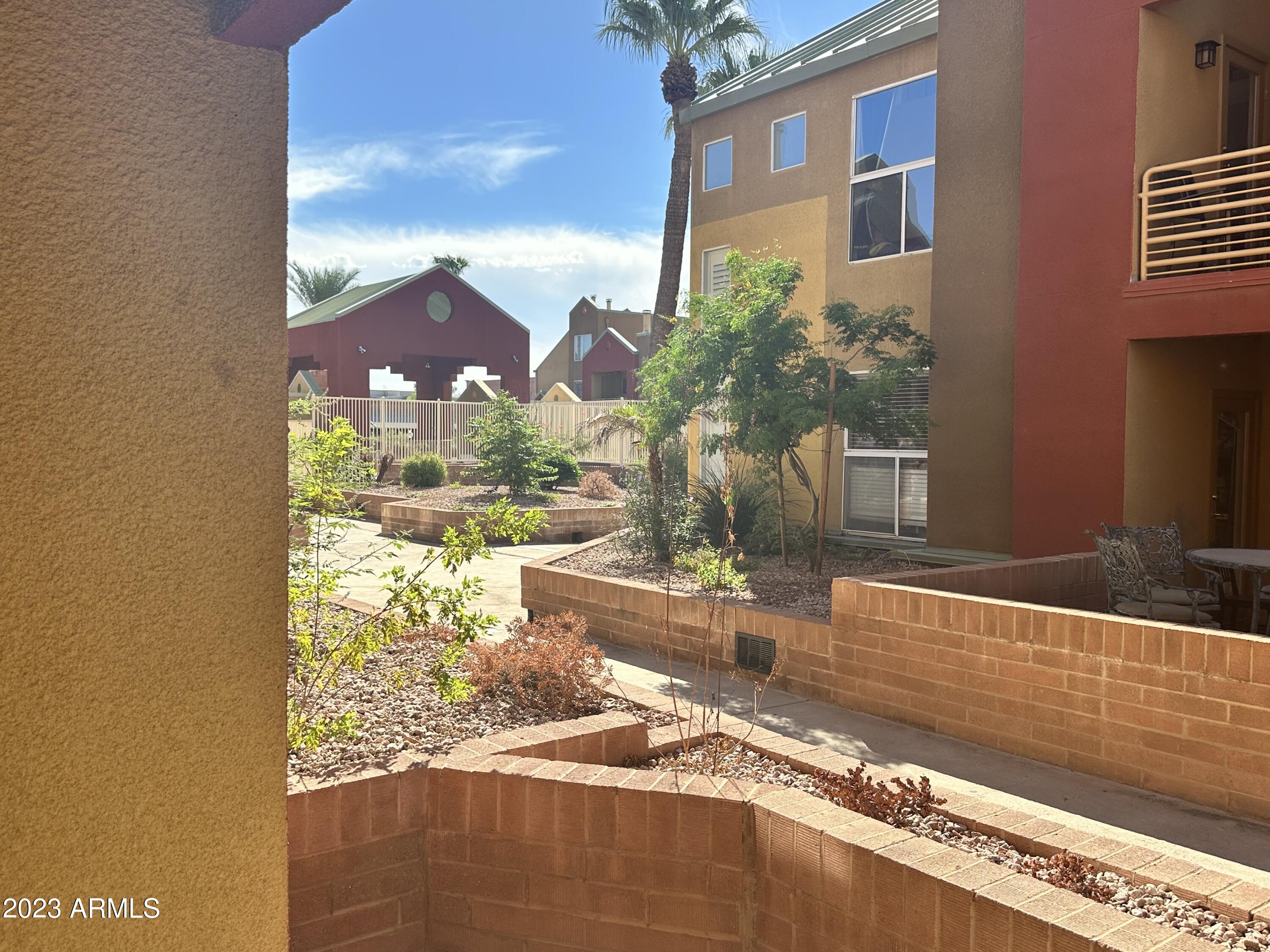 154 West 5th Street, Unit 149 Tempe, AZ 85281 - Photo 8 of 9 a view of a building from a patio
