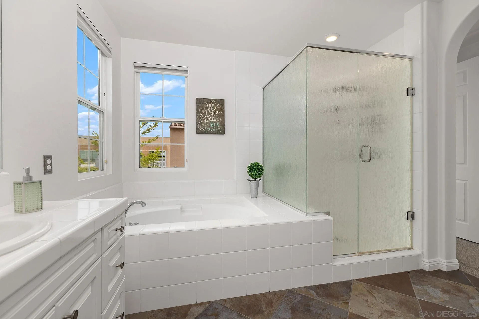 2149 Historic Decatur Road San Diego, CA 92106 - Photo 26 of 32 a bathroom with a bathtub and a sink