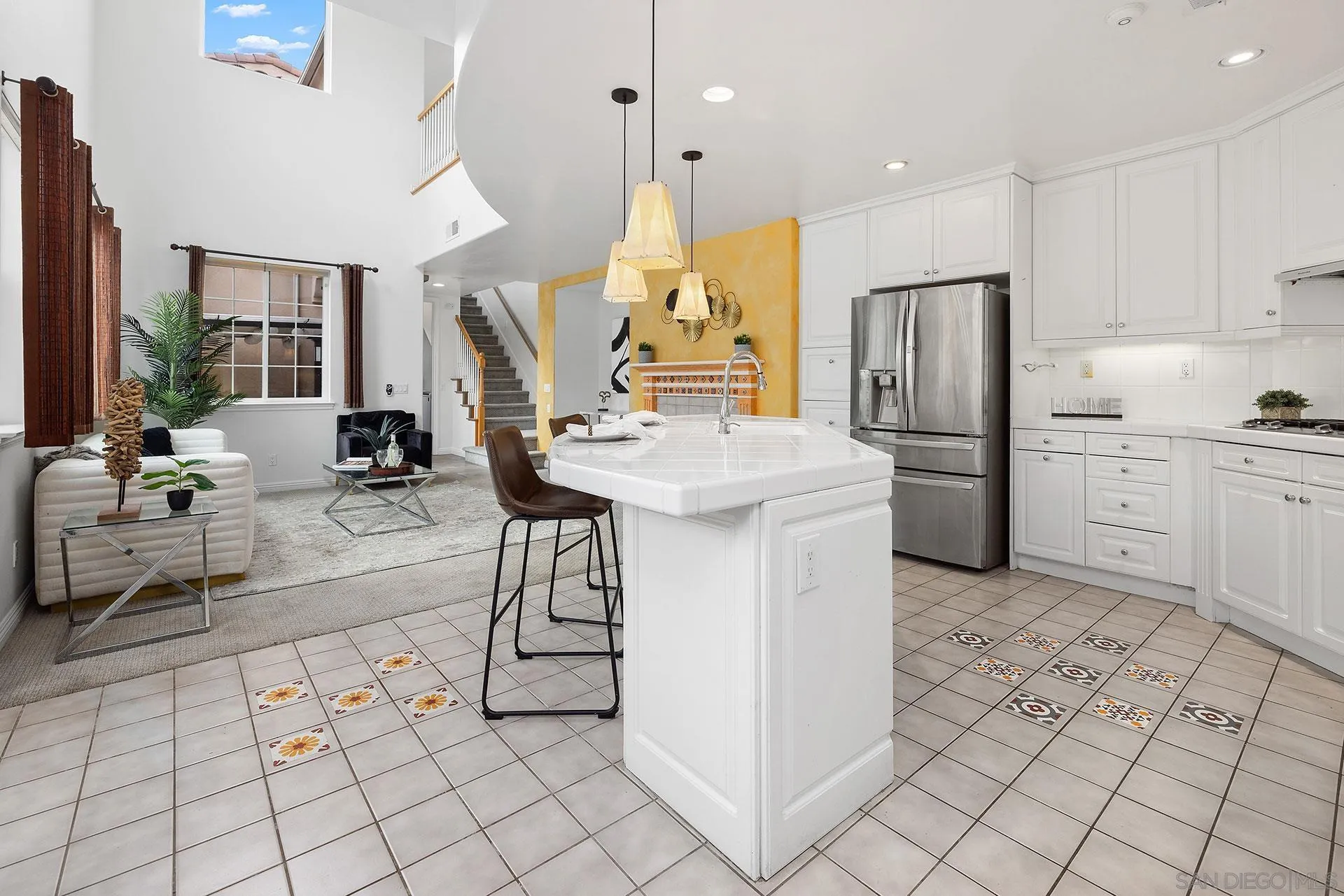 2149 Historic Decatur Road San Diego, CA 92106 - Photo 5 of 32 a kitchen with stainless steel appliances granite countertop a stove a sink a chimney and a refrigerator