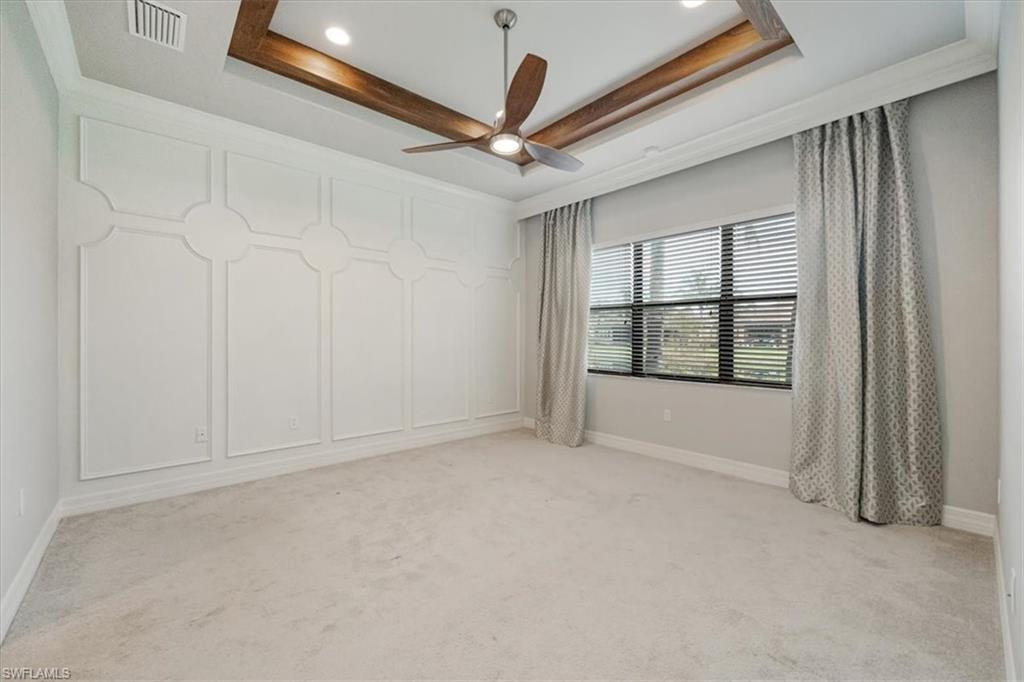 13418 Silktail Drive Naples, FL 34109 - Photo 21 of 36 an empty room with windows and fan