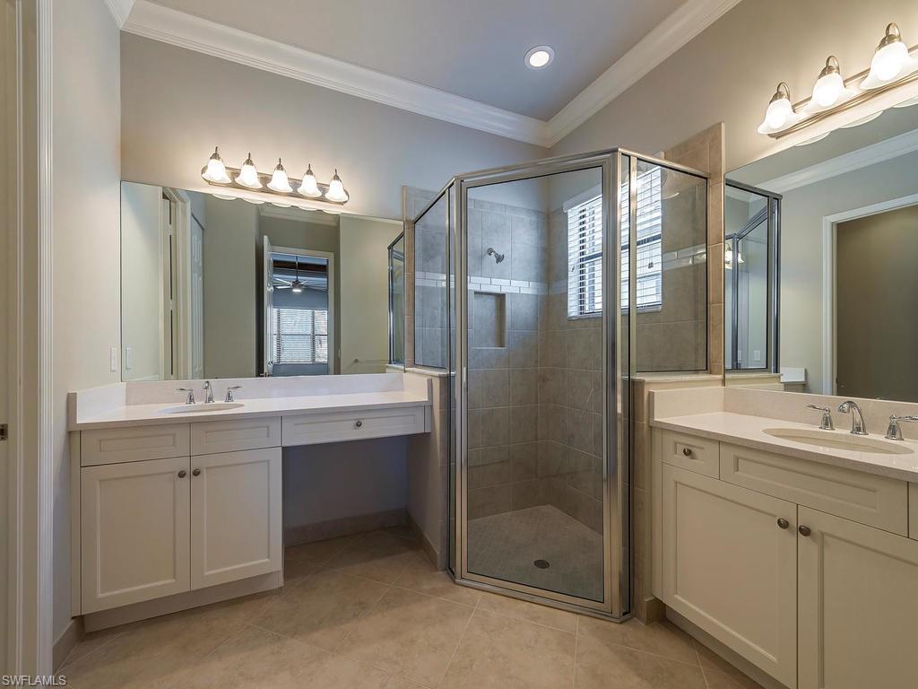 13418 Silktail Drive Naples, FL 34109 - Photo 23 of 36 a bathroom with a double vanity sink mirror and double