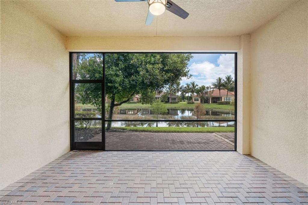 13418 Silktail Drive Naples, FL 34109 - Photo 33 of 36 a view of entryway with a floor to ceiling window and an outdoor space