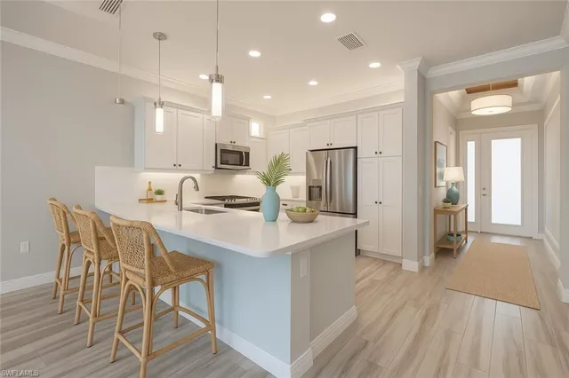 a view of an empty room and wooden floor