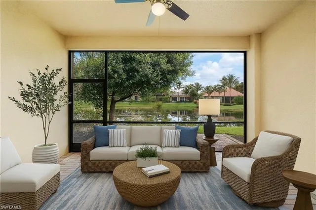 a view of a livingroom with a hardwood floor and a ceiling fan
