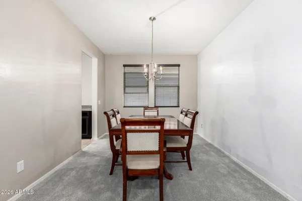 a dining room with furniture and window