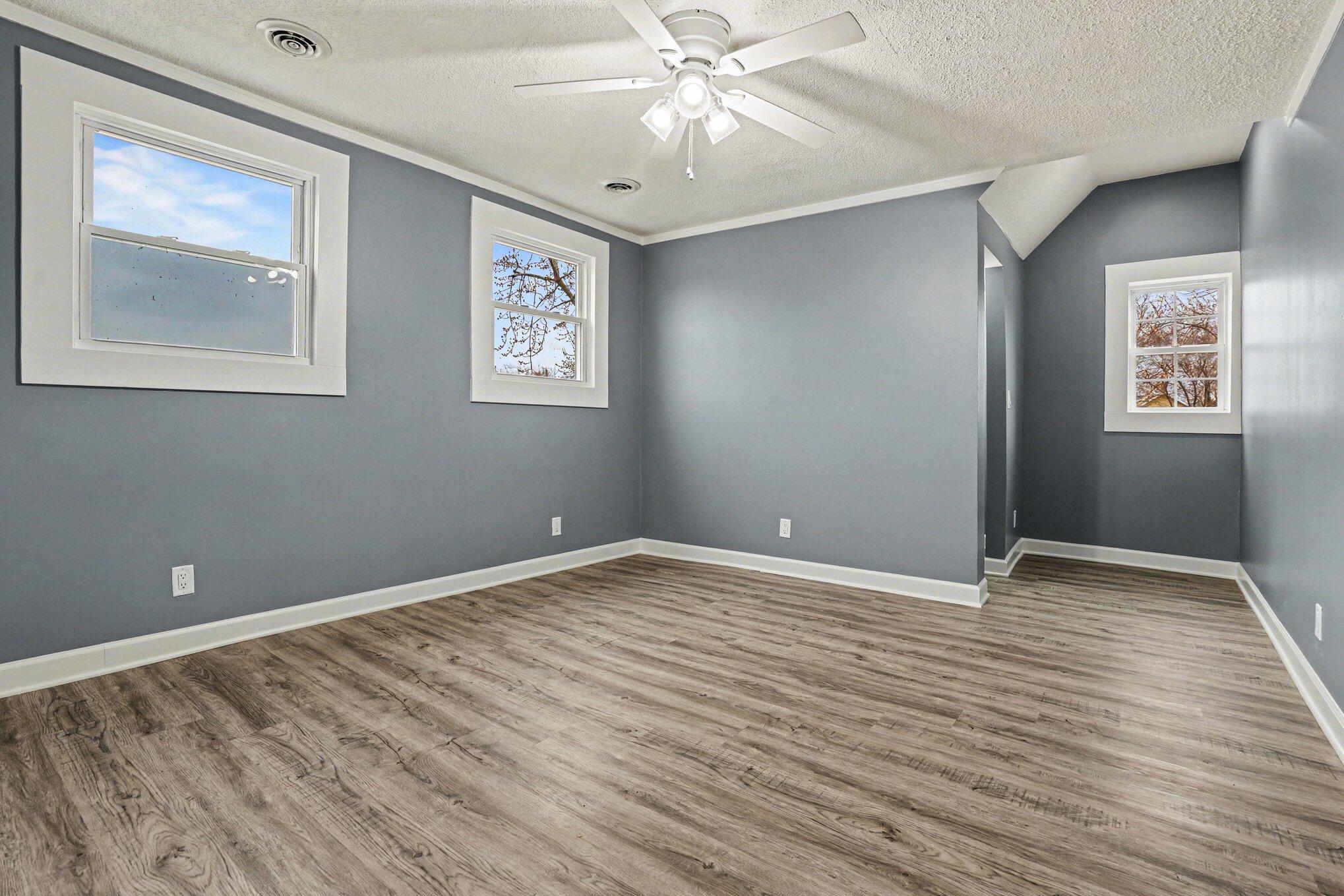 1803 Tennessee Street Michigan City, IN 46360 - Photo 12 of 14 a view of an empty room with window and wooden floor
