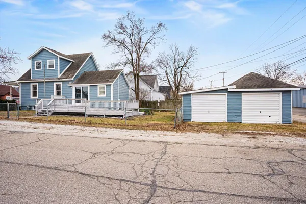 a house that has a tree in front of it
