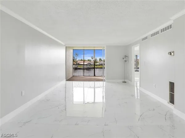 a view of a kitchen with a sink and a window