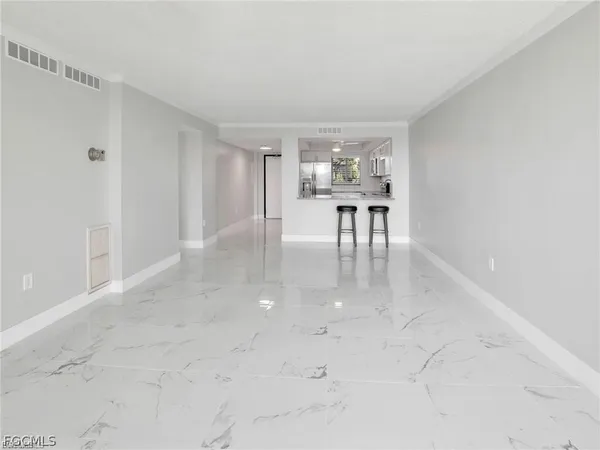 a view of work space with table and chairs