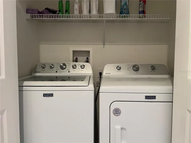 a utility room with dryer and washer