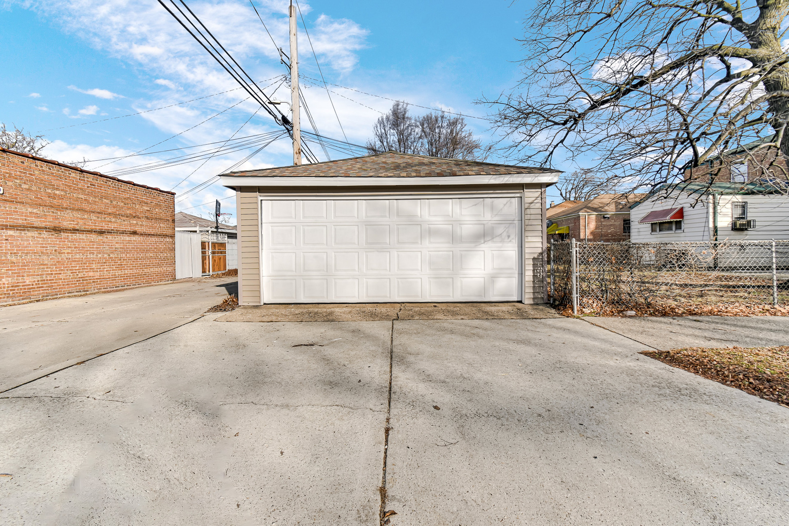 10558 South Prairie Avenue Chicago, IL 60628 - Photo 16 of 16 a view of garage yard and garage
