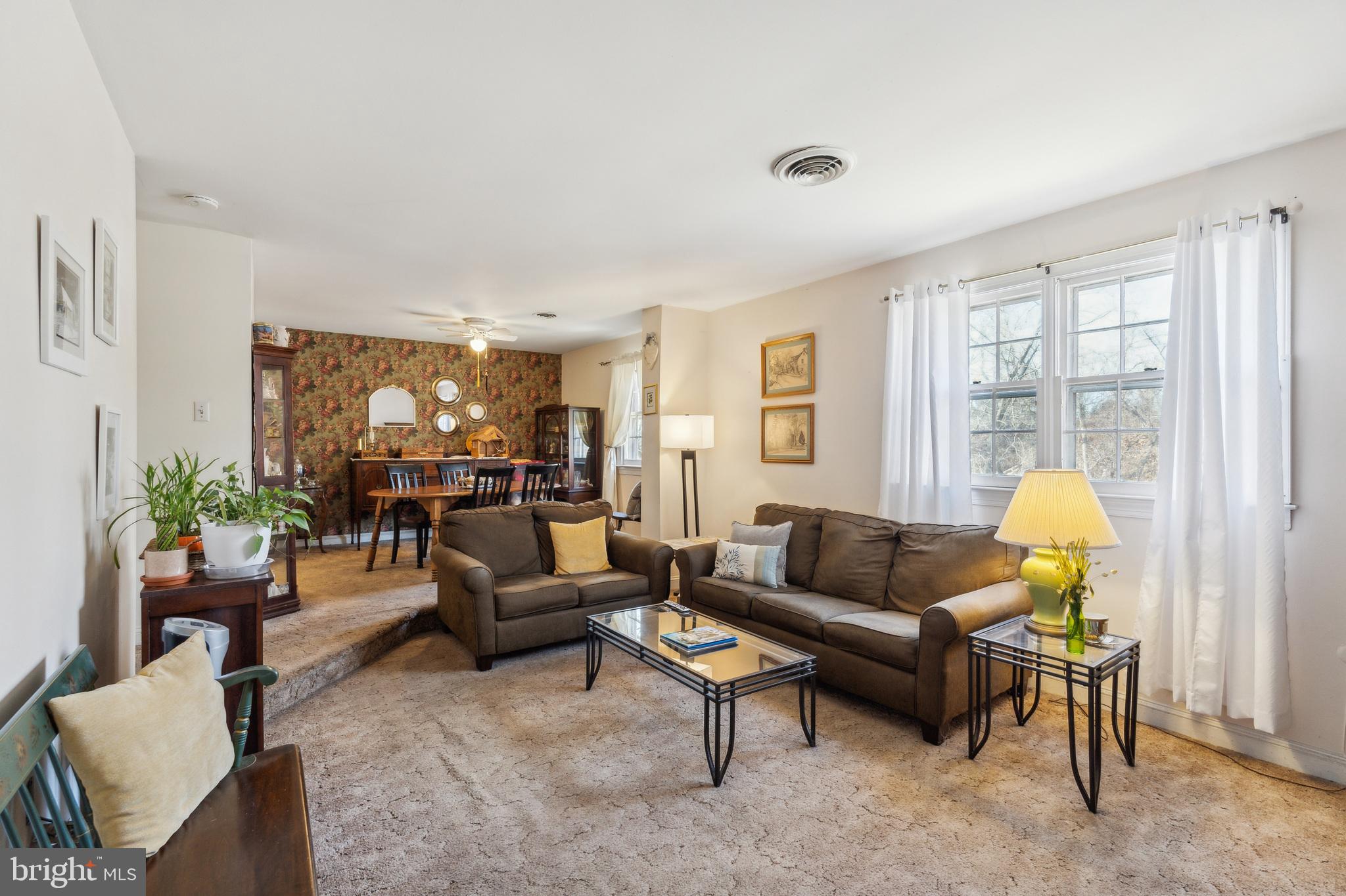 203 Yardley Commons Yardley, PA 19067 - Photo 5 of 12 a living room with furniture and a table