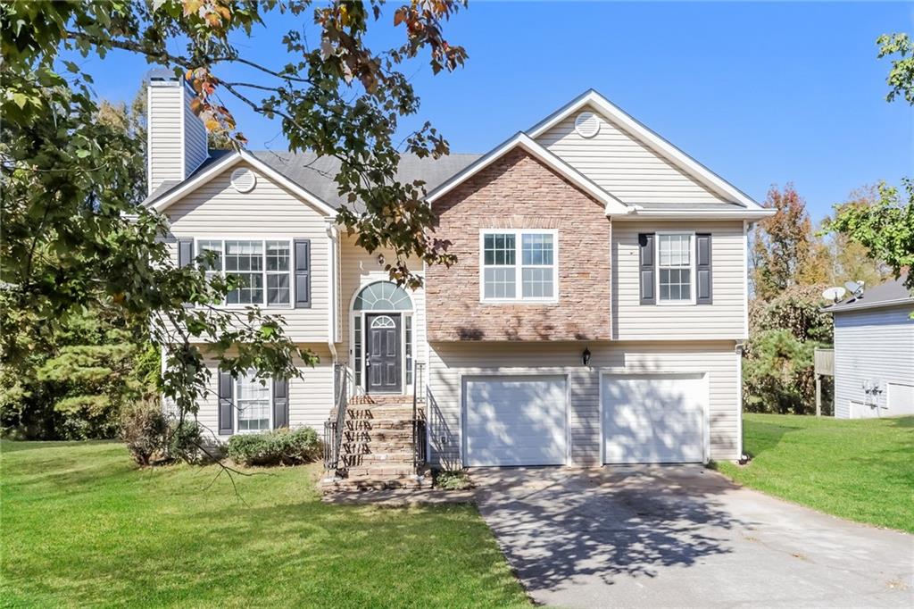 a front view of a house with a yard