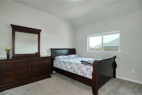 a large bathroom with a glass shower door