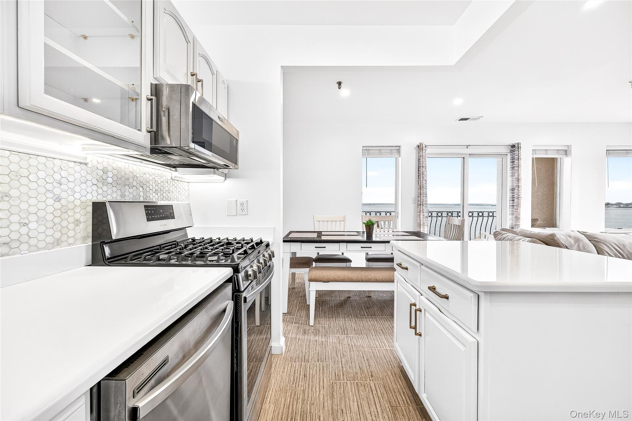 1432 Outlook Avenue, Unit 2 Bronx, NY 10465 - Photo 13 of 39 a kitchen with stainless steel appliances granite countertop a sink stove and refrigerator