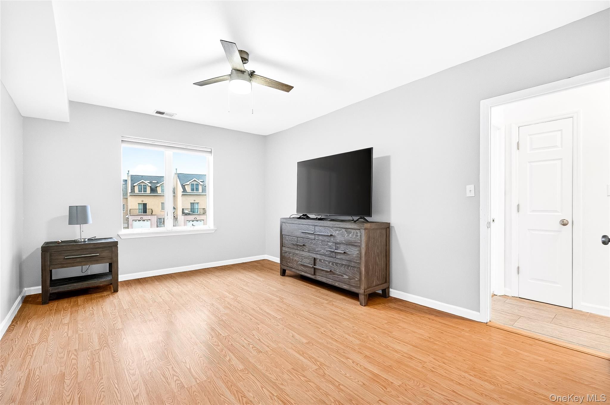 1432 Outlook Avenue, Unit 2 Bronx, NY 10465 - Photo 19 of 39 a living room with furniture and a flat screen tv