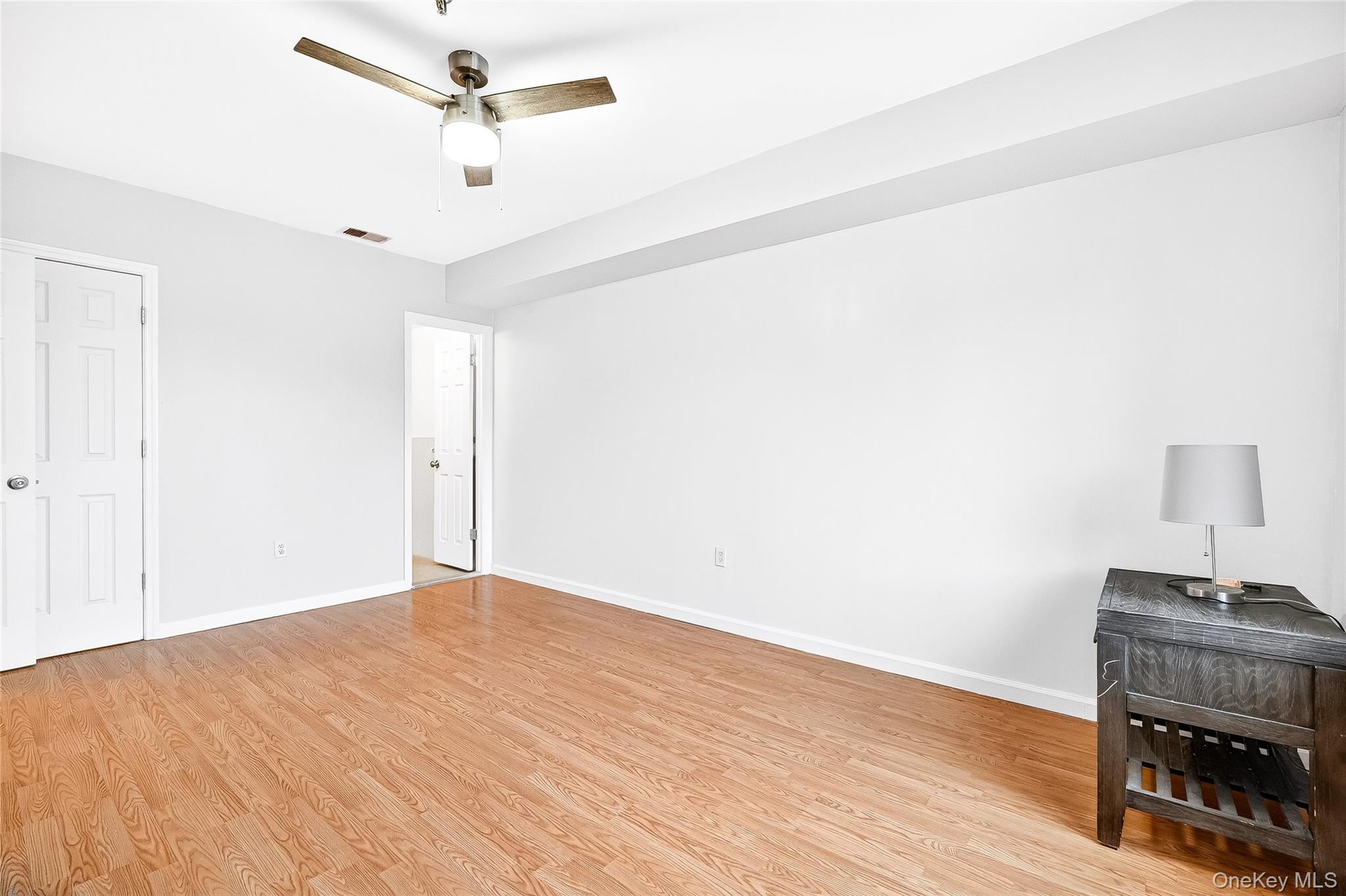 1432 Outlook Avenue, Unit 2 Bronx, NY 10465 - Photo 22 of 39 a view of an empty room and wooden floor