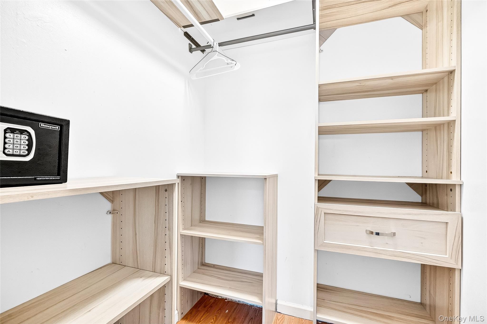 1432 Outlook Avenue, Unit 2 Bronx, NY 10465 - Photo 25 of 39 a view of walk in closet with empty racks