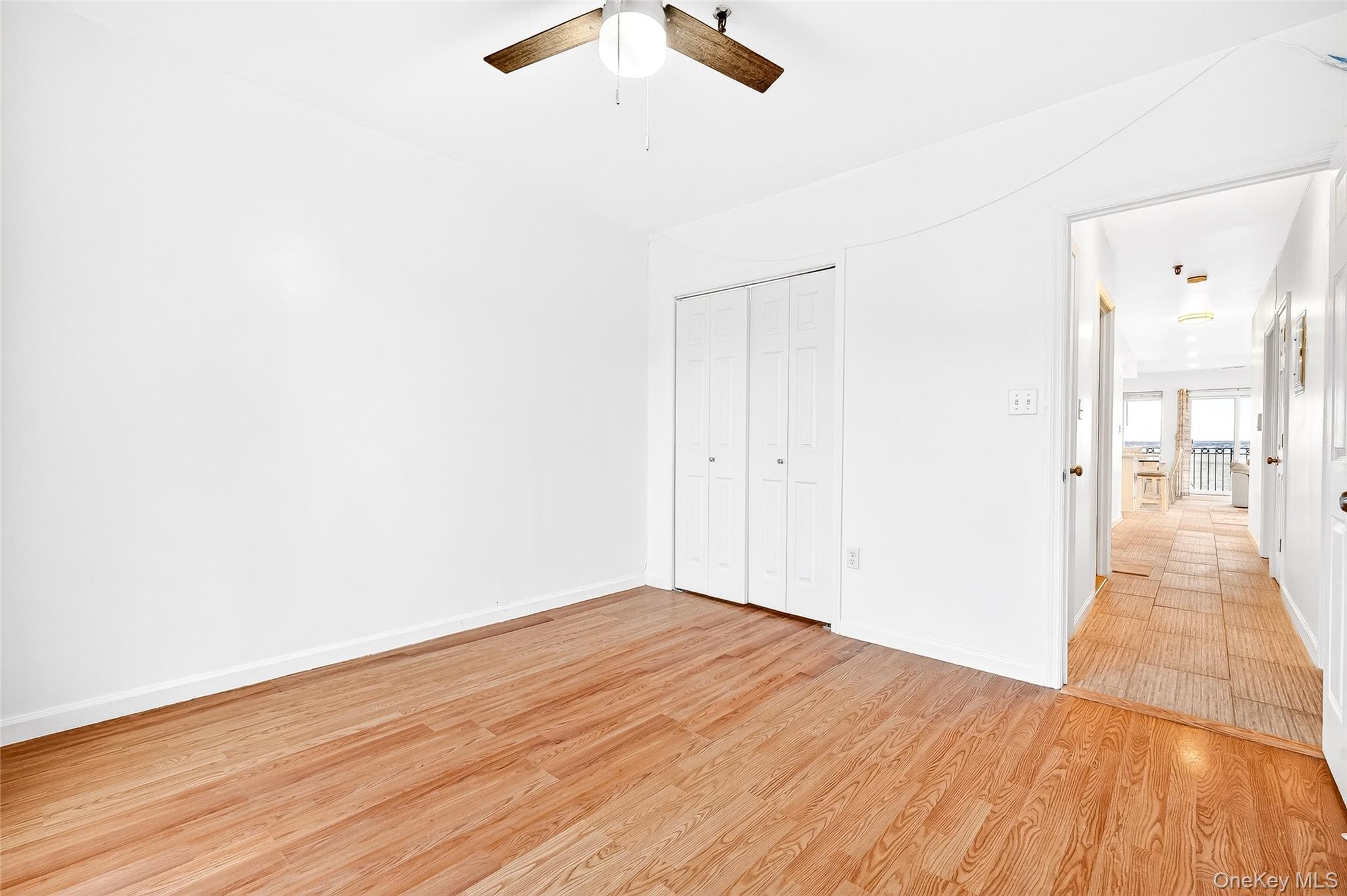 1432 Outlook Avenue, Unit 2 Bronx, NY 10465 - Photo 28 of 39 a view of a room with wooden floor