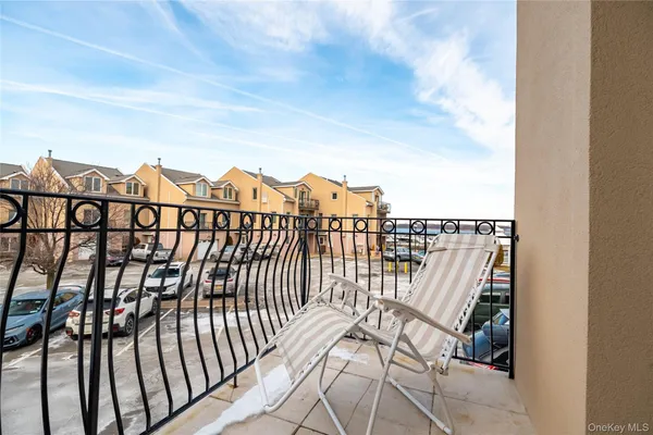 a view of a balcony with wooden floor