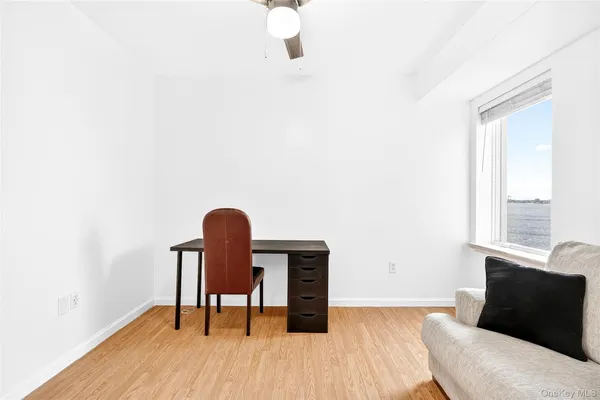a workspace with furniture and wooden floor