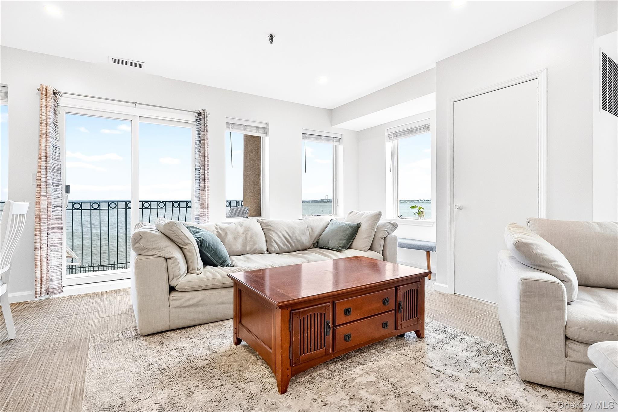 1432 Outlook Avenue, Unit 2 Bronx, NY 10465 - Photo 4 of 39 a living room with furniture and a large window