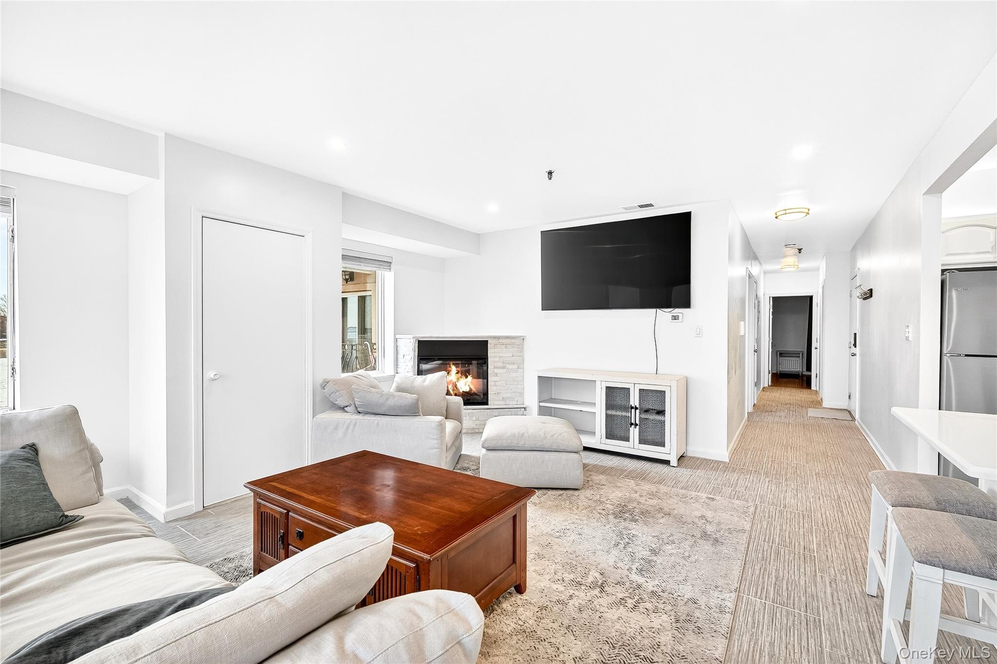 1432 Outlook Avenue, Unit 2 Bronx, NY 10465 - Photo 5 of 39 a living room with furniture and a flat screen tv