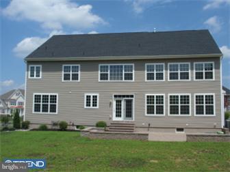 51 Curtmantle Road Mickleton, NJ 08056 - Photo 2 of 12 a front view of a house with a yard