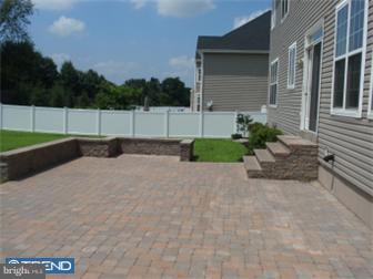 51 Curtmantle Road Mickleton, NJ 08056 - Photo 12 of 12 a white house with a yard and plants