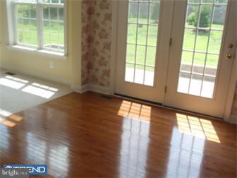 51 Curtmantle Road Mickleton, NJ 08056 - Photo 5 of 12 a view of an empty room with wooden floor and a window