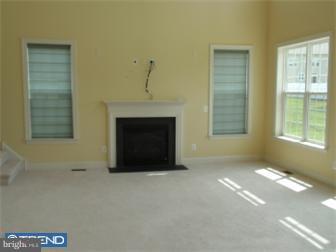 51 Curtmantle Road Mickleton, NJ 08056 - Photo 7 of 12 a living room with a fireplace and a window