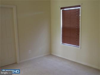 51 Curtmantle Road Mickleton, NJ 08056 - Photo 10 of 12 a view of an empty room with a window