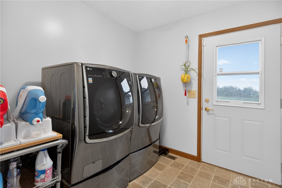 5264 Frazier-Guy Road Sidney, OH 45365 - Photo 42 of 51 This dedicated space offers practicality for daily chores with efficient appliances.